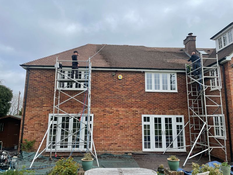 Roof cleaning carried out safely from scaffold towers by The Roof Moss Cleaners in Blackfield